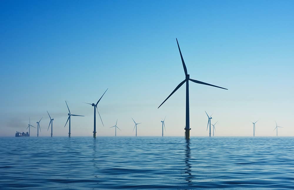 A vast wind farm in the ocean on a calm day